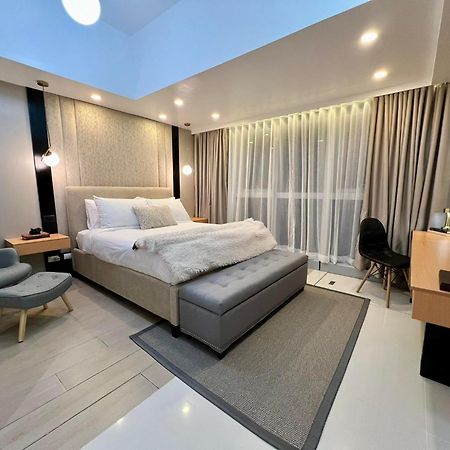 تاغويغ Hotel Vibe Condo At Uptown Parksuites Bgc المظهر الخارجي الصورة