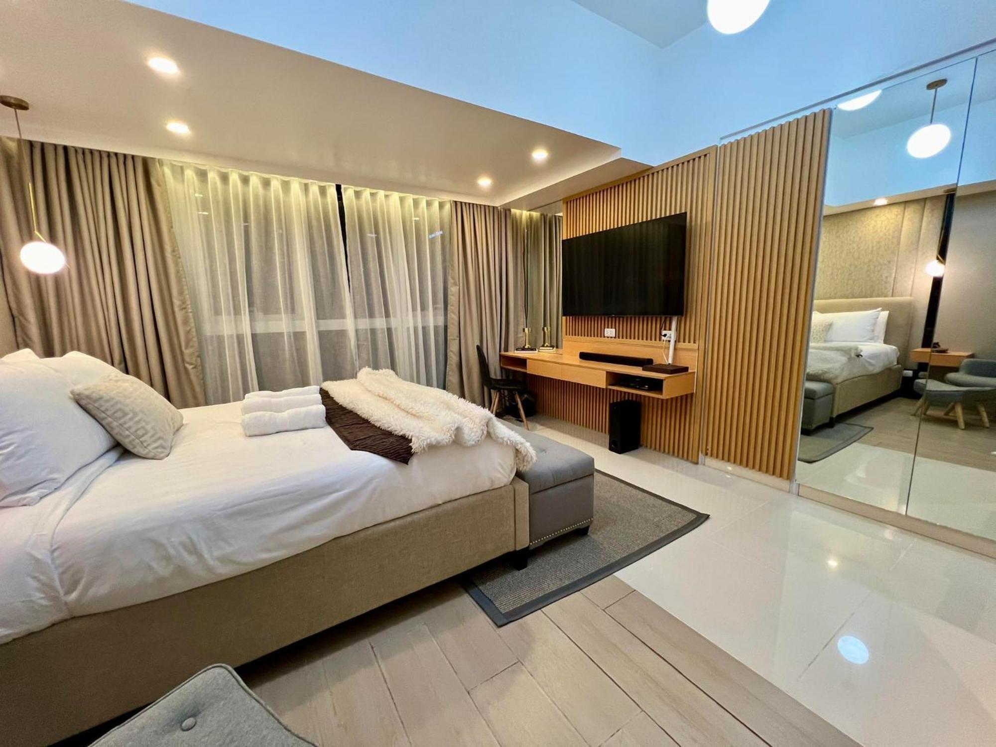 تاغويغ Hotel Vibe Condo At Uptown Parksuites Bgc المظهر الخارجي الصورة